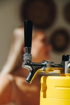 Close-up of a beer tap with a blurred background